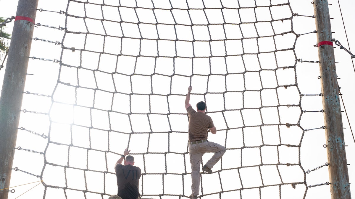 JD Vance climbs ropes course with SEALS