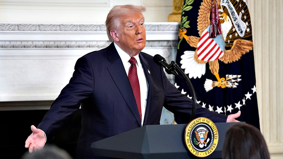 President Donald Trump gestures while speaking