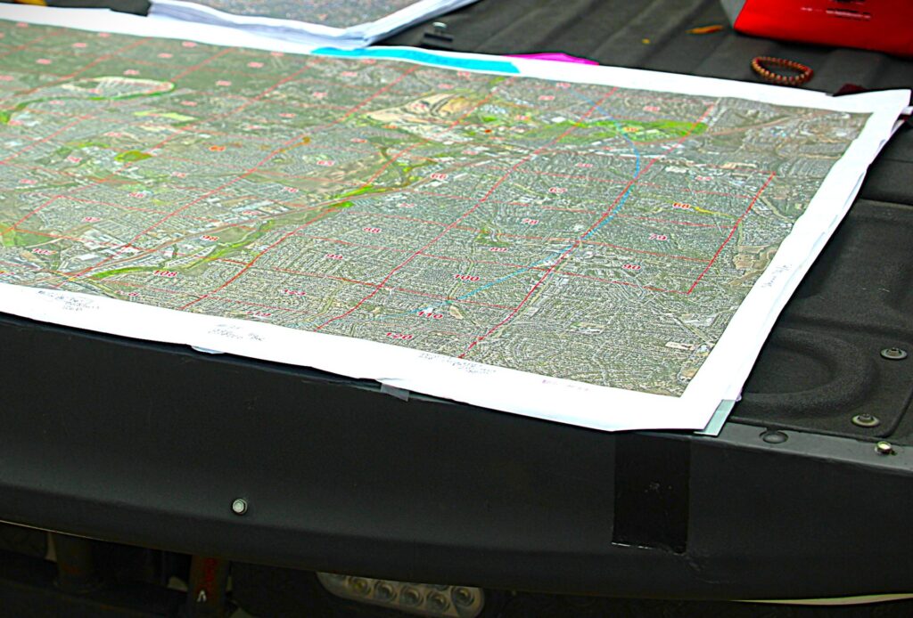 Search organizers use topographical map to track searched areas and plan the day's operations. (Randy Clark/Breitbart Texas)