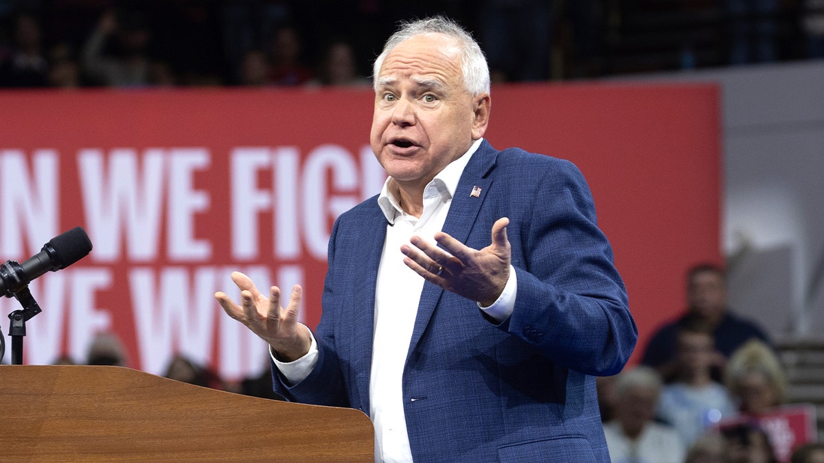 Tim Walz shrugs while on the campaign trail