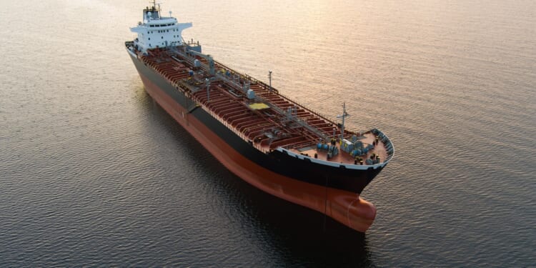 An oil tanker at sunset.