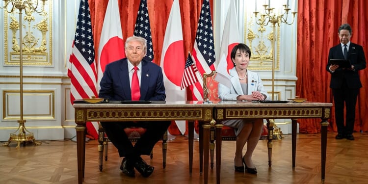 Donald Trump and Sanae Takaichi at a signing ceremony.