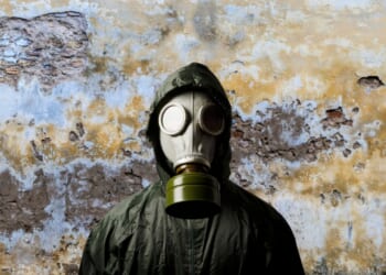 Man with gas mask to protect from chemical weapons.