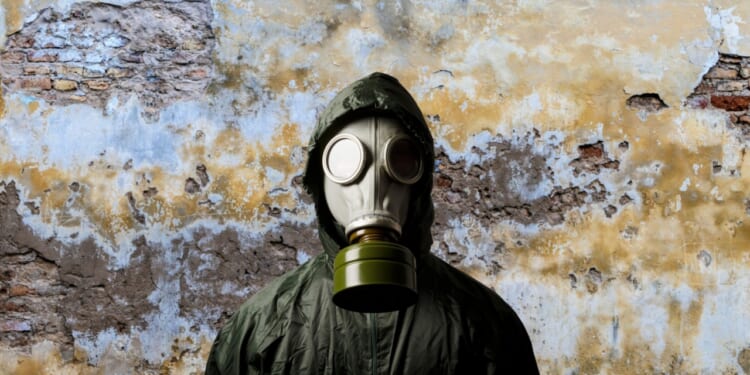 Man with gas mask to protect from chemical weapons.
