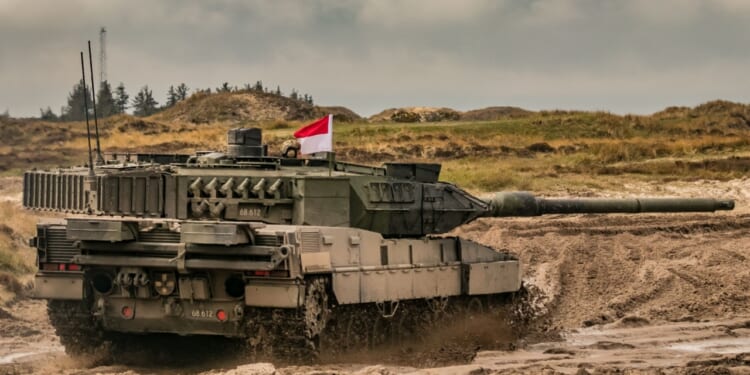 A Leopard 2 tank in rough terrain.