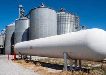 An ammonia tank near corn elevators.