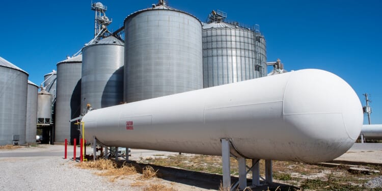 An ammonia tank near corn elevators.