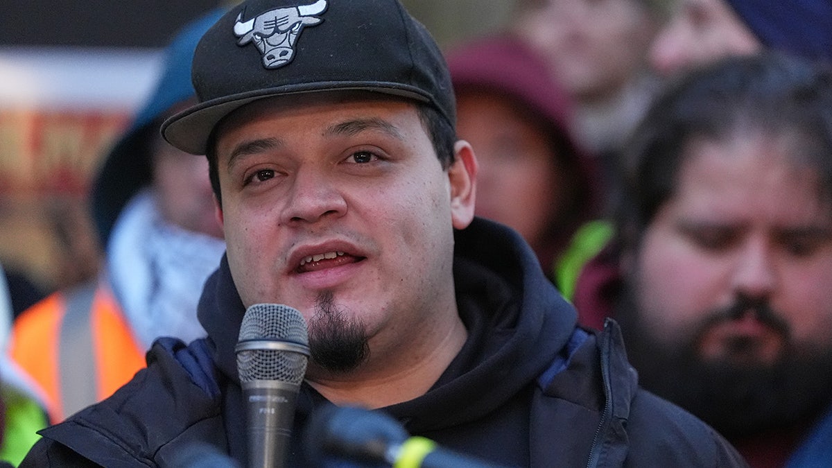 Kilmar Abrego Garcia speaks at microphone during rally