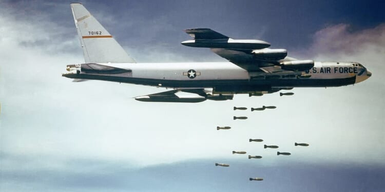 A US Air Force B-52 dropping bombs on Vietnam.