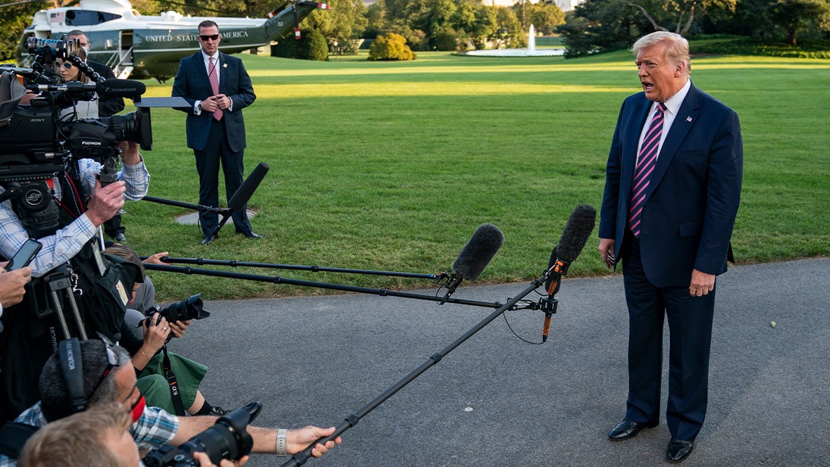 Trump speaks with media