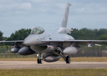 An F-16 Fighting Falcon on the tarmac.