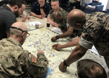 A group of soldiers conducting a wargame exercise.