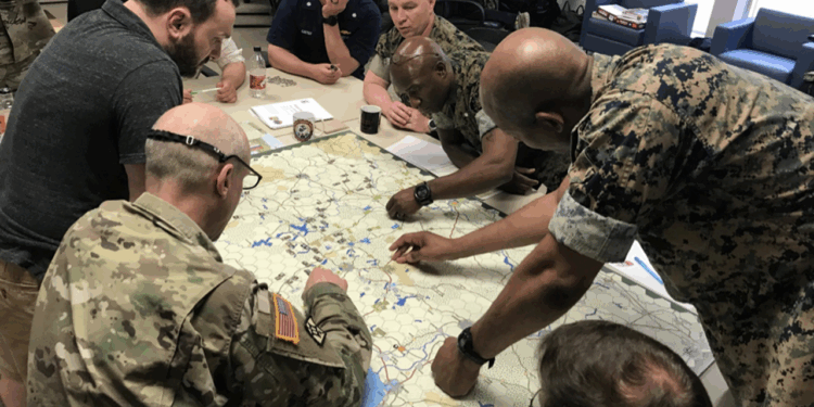 A group of soldiers conducting a wargame exercise.