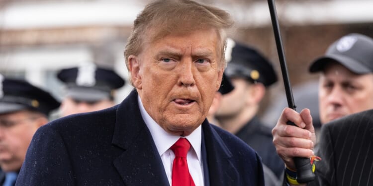 Donald Trump attends a funeral.