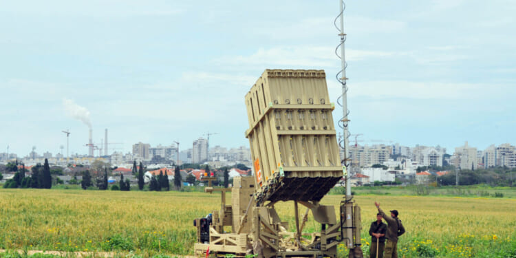 Israeli soldier near Iron Dome that deployed in Ashkelon, Israel.