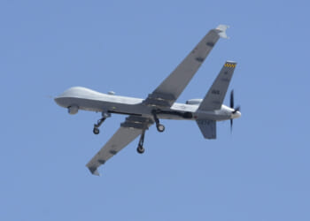 A U.S. Air Force MQ-9 Reaper remotely piloted aircraft assigned to the 432nd Wing comes in for a touch-and-go while another waits to take off at Creech Air Force Base, Nevada, May 22, 2025.