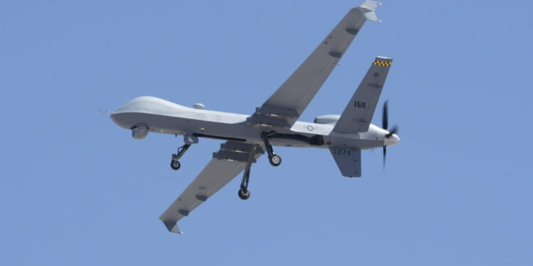 A U.S. Air Force MQ-9 Reaper remotely piloted aircraft assigned to the 432nd Wing comes in for a touch-and-go while another waits to take off at Creech Air Force Base, Nevada, May 22, 2025.