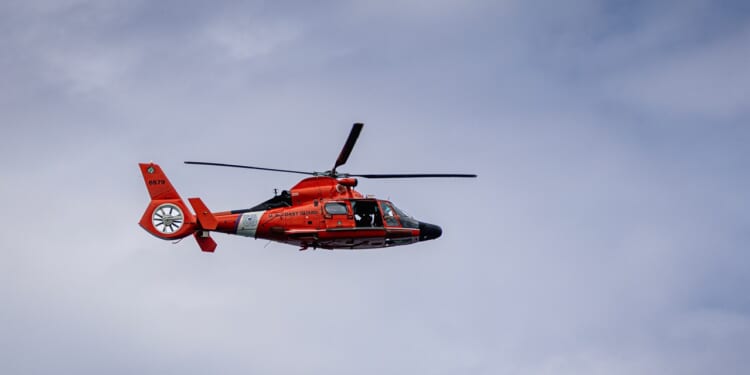 An MH-65 Dolphin helicopter in flight.