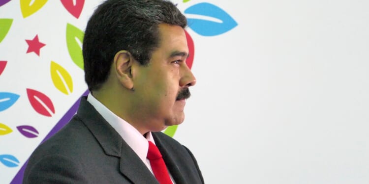 A sideways profile of Nicolas Maduro.