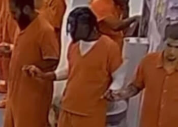 Michigan Inmates Join Hands to Pray the Lord's Prayer