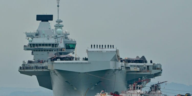 British aircraft carrier HMS Prince of Wales, one of the largest warships in the world, on arrival at Marina Bay Cruise Centre.