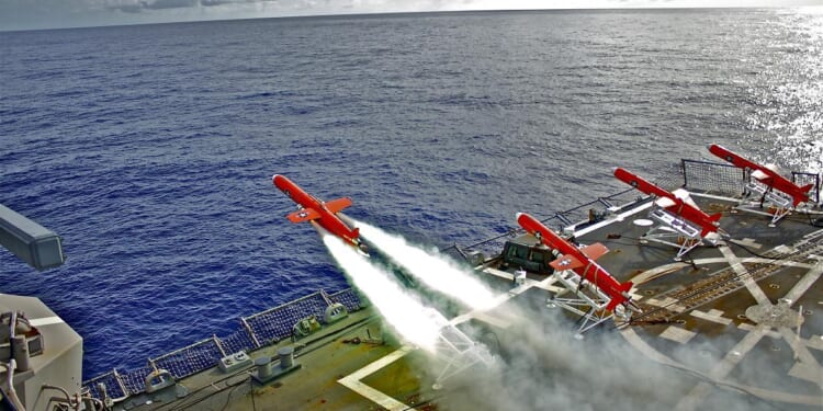 A BQM-74E drone launches from the flight deck of the Arleigh Burke-class guided-missile destroyer USS Lassen during a missile exercise to provide defense training for U.S. Marine Corps F/A-18 pilots.