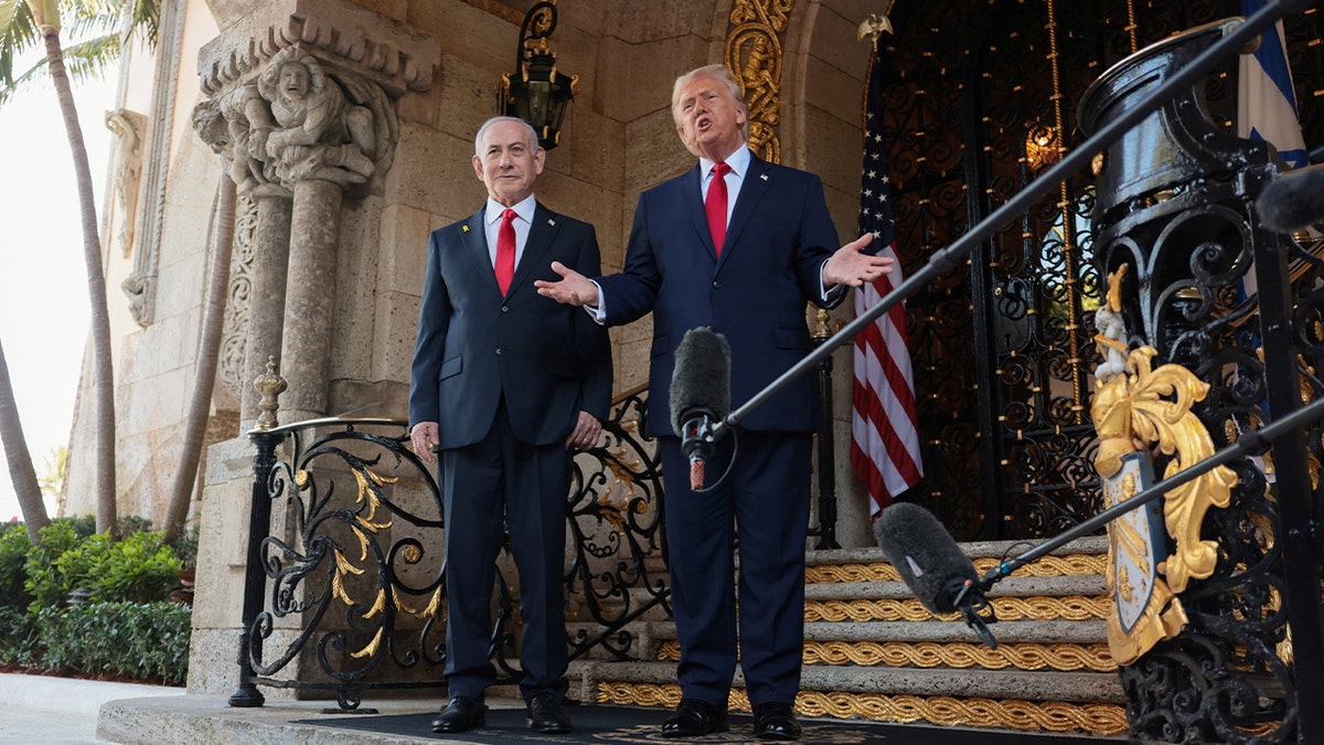 U.S. President Donald Trump speaks to the media next to Israeli Prime Minister Benjamin Netanyahu upon arrival for meetings at Trump's Mar-a-Lago club in Palm Beach, Florida.