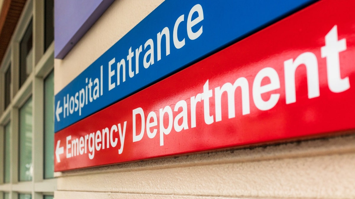 Sign at a hospital reading Hospital entrance and emergency department