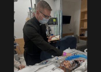 Micah Kim, 5, son of popular Catholic speaker Paul Kim, is anointed by a priest on Dec. 26, 2025. Credit: Courtesy of Paul Kim