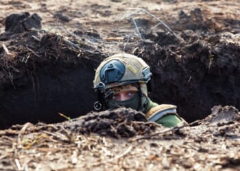 A Ukrainian Armed Forces soldier is seen with a rifle in a trench at a combat position during a combat mission in Donetsk region, Ukraine.