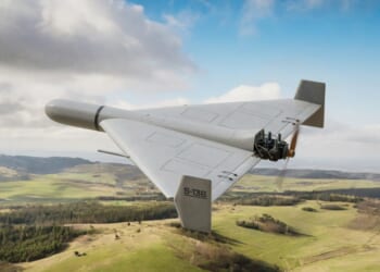 A Shahed-136 military drone flying in the air.