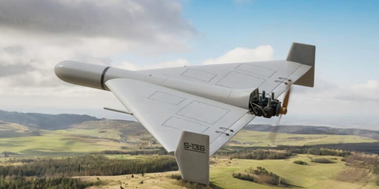 A Shahed-136 military drone flying in the air.