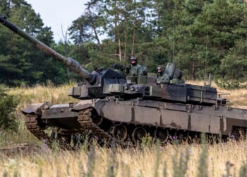 A K2 Black Panther tank climbing a hill.
