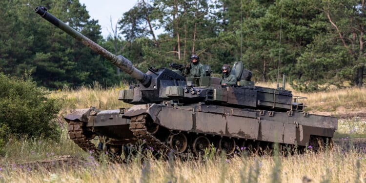 A K2 Black Panther tank climbing a hill.
