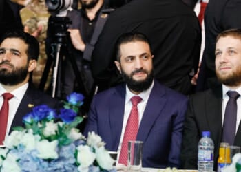 Syrian president Ahmed al-Shara appears at Syrian reconstruction event.