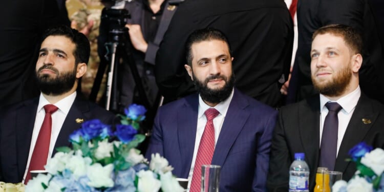 Syrian president Ahmed al-Shara appears at Syrian reconstruction event.