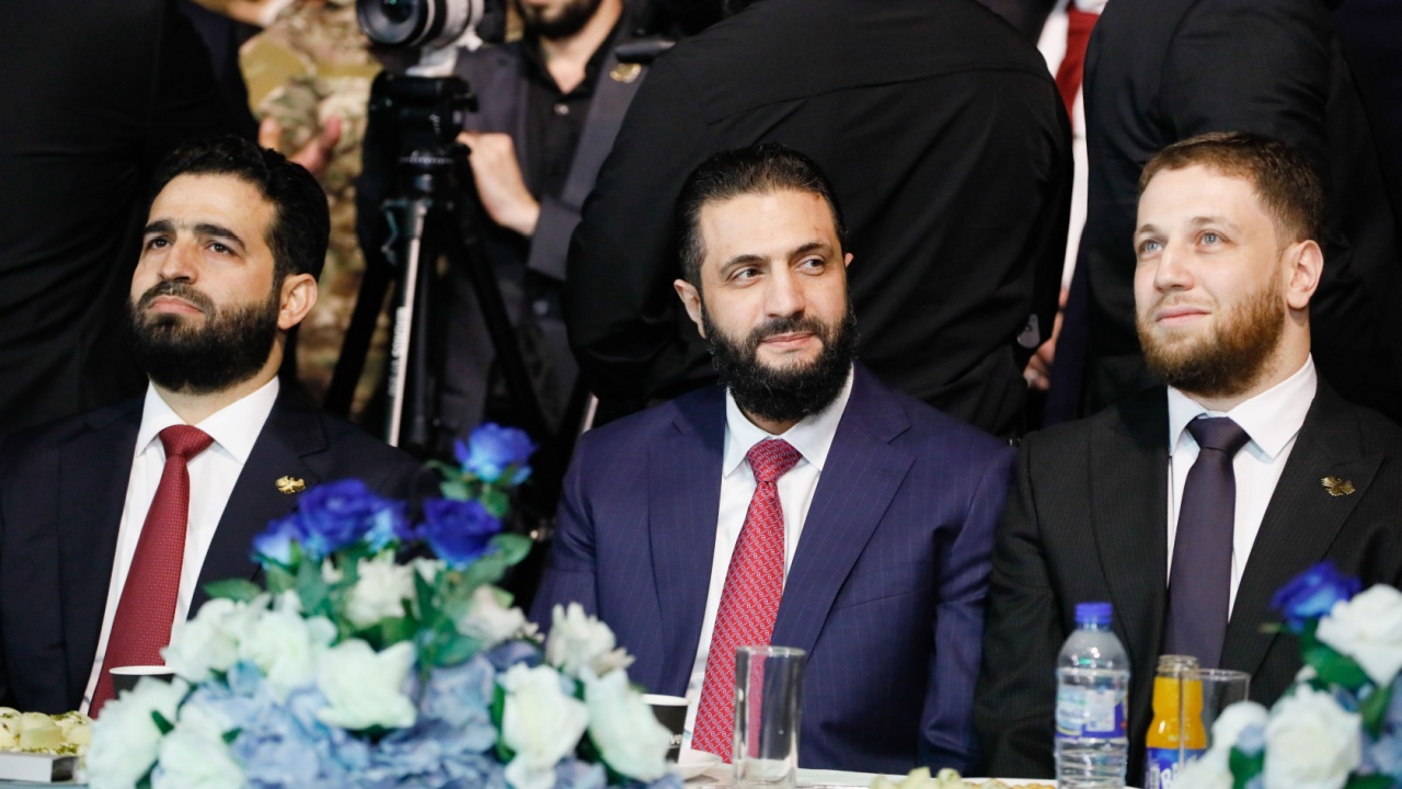 Syrian president Ahmed al-Shara appears at Syrian reconstruction event.