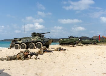 Thai BTR vehicles on a beach.