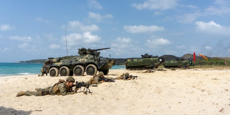 Thai BTR vehicles on a beach.