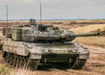 Leopard 2 armored tank in terrain.