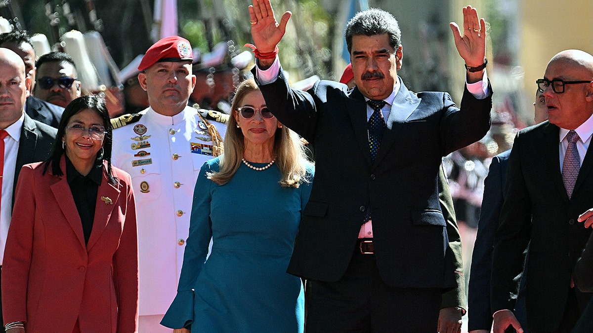 Venezuela's President Nicolas Maduro (2nd R) waves next to First Lady Cilia Flores, Vice President Delcy Rodriguez (