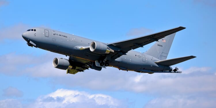 A KC-46 Pegasus with its landing gear down.