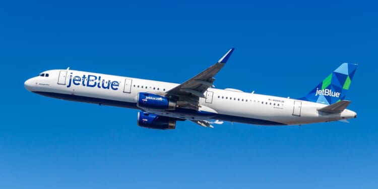 A JetBlue plane in flight.