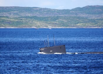 A Russian Kilo-class submarine diving.