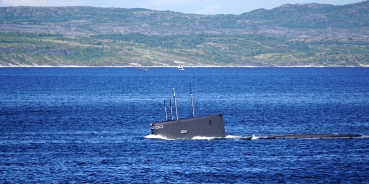 A Russian Kilo-class submarine diving.