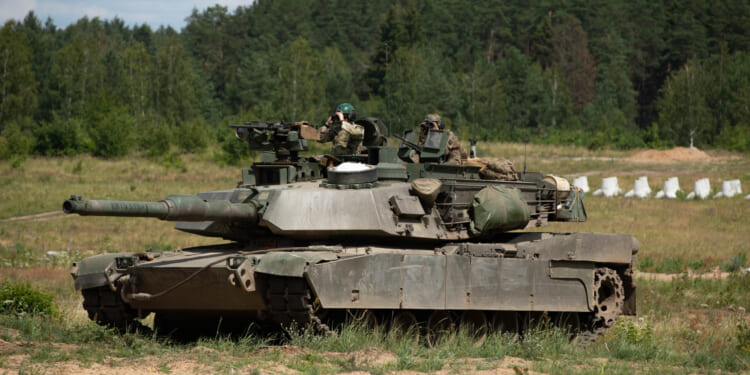 U.S. Army soldiers operate a M1A2 System Enhanced Package V3 Abrams Main Battle Tank during a situational training exercise at Bemowo Piskie Training Area, Poland, July 8, 2025.