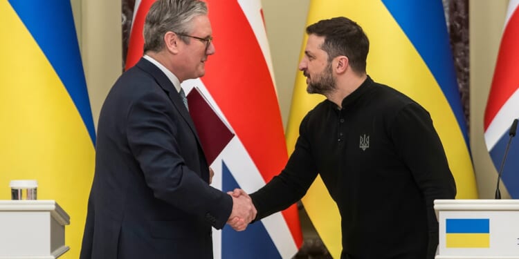 Keir Starmer and Volodymyr Zelensky shaking hands.