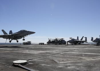 A fighter jet landing on the USS Gerald R. Ford.