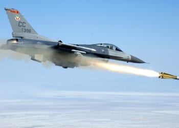 An F-16 Fighting Falcon fighter jet firing a missile.
