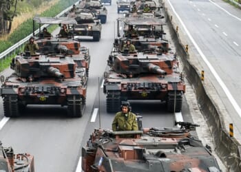 A column of Greek tanks in a parade.
